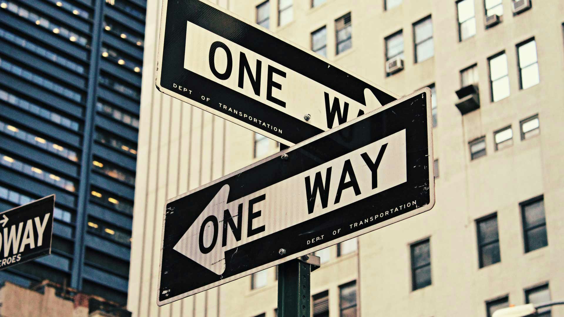Two One-Way Signs Diverging